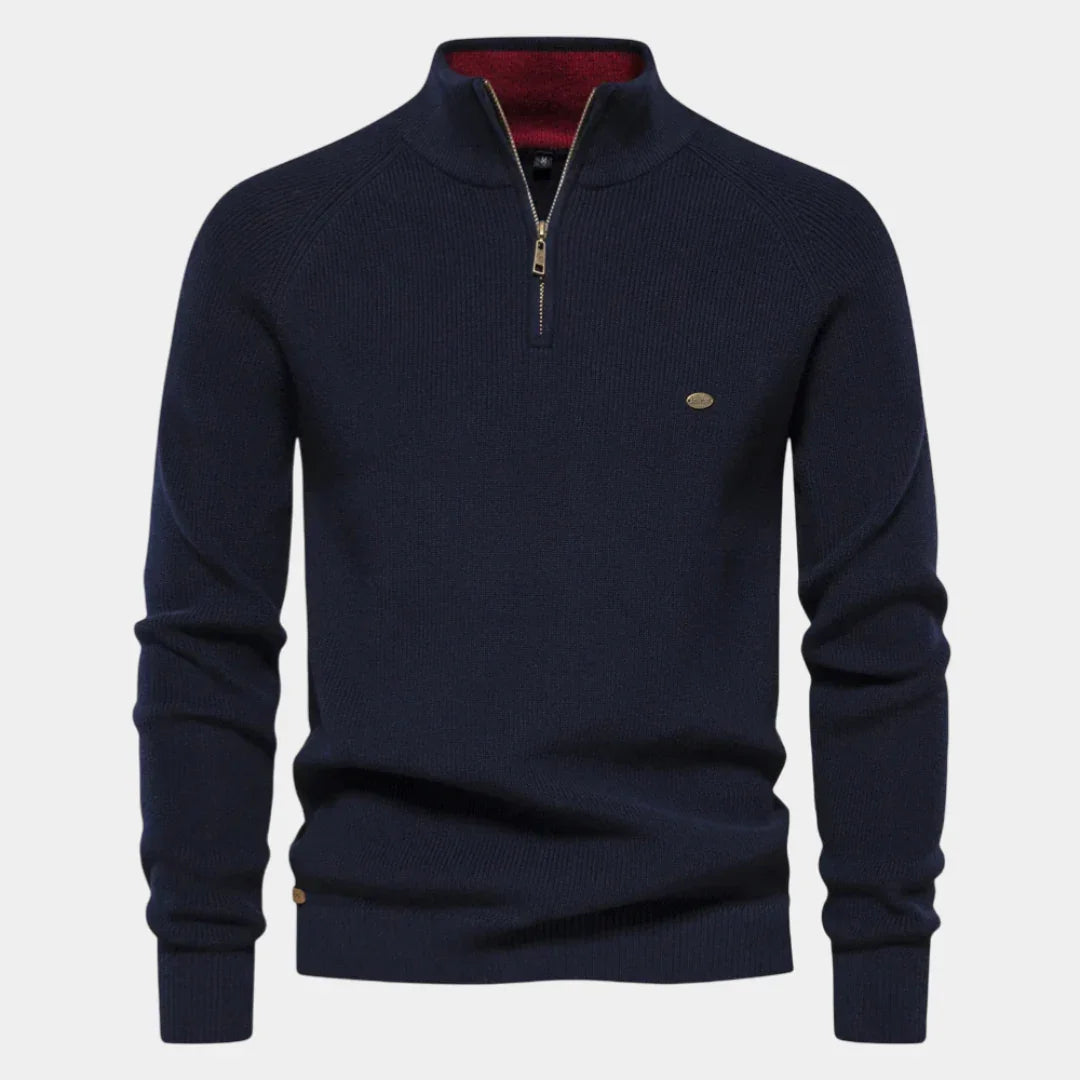 Men's navy quarter-zip knit pullover with long sleeves, ribbed cuffs, and hem