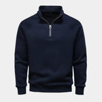 Men's navy quarter-zip sweater with stand collar and ribbed cuffs and hem.