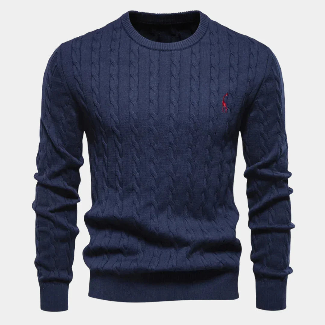 Men's navy blue cable-knit crewneck sweater with long sleeves and small chest logo