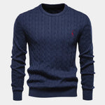 Men's navy blue cable-knit crewneck sweater with long sleeves and small chest logo