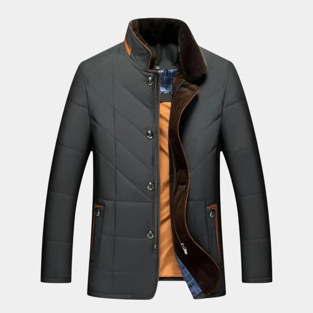 Black quilted winter jacket with snap front, brown trim, and plaid-lined inner collar