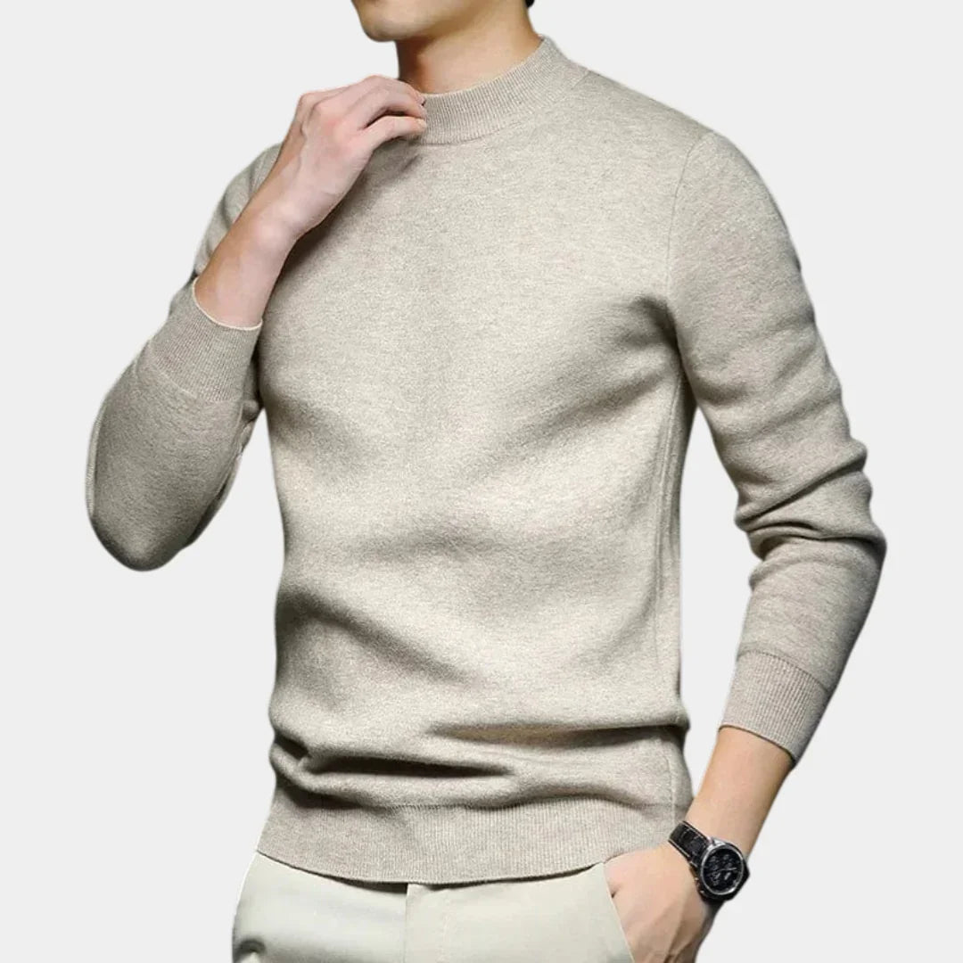 Ivory high-neck knit sweater with long sleeves and ribbed hem and cuffs.