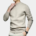 Ivory high-neck knit sweater with long sleeves and ribbed hem and cuffs.