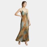 Printed maxi dress with spaghetti straps and V-neck, teal-rust abstract pattern, side view