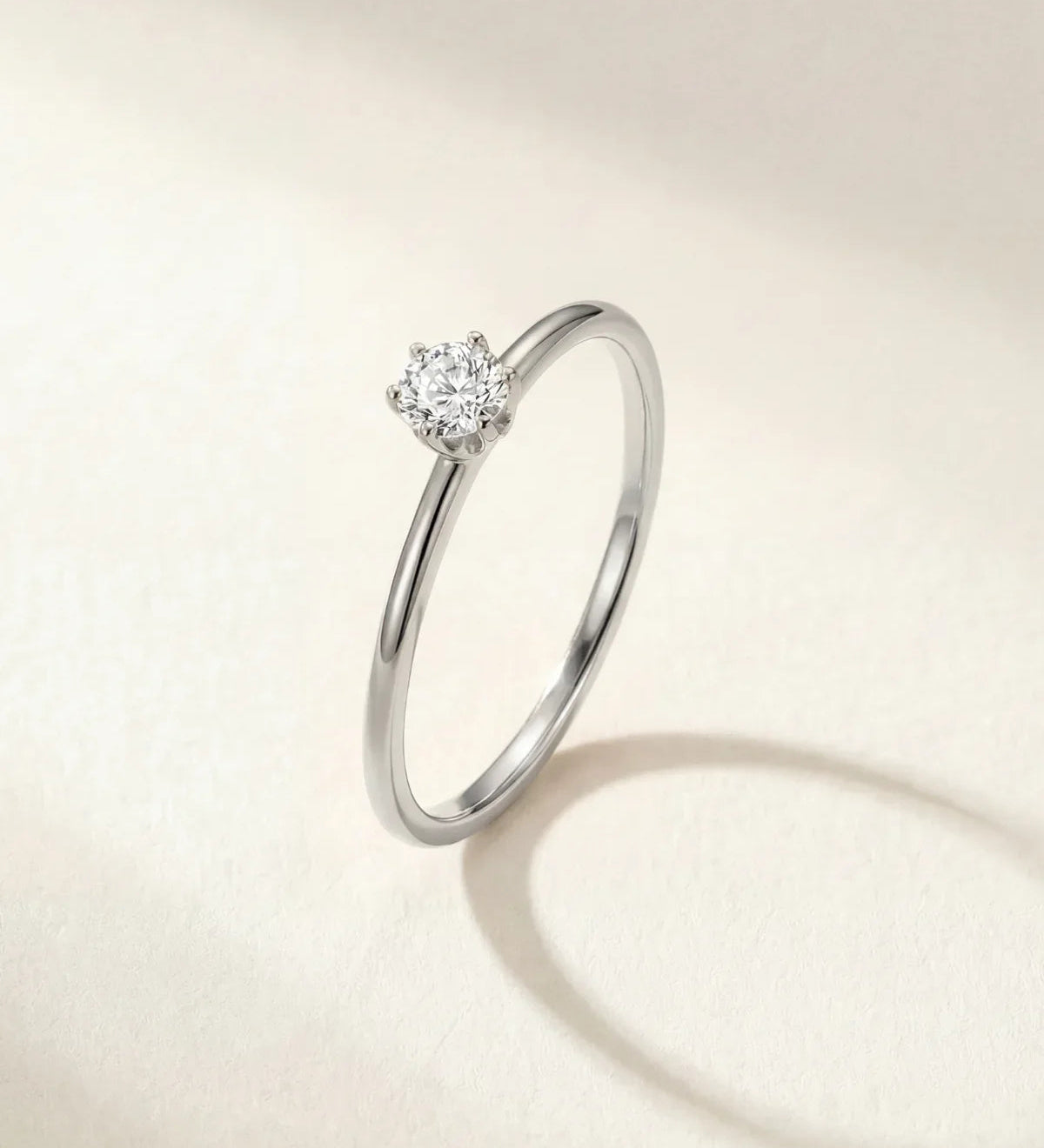 Silver-tone solitaire ring with round gemstone centerpiece