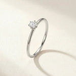 Silver-tone solitaire ring with round gemstone centerpiece