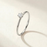 Silver-tone solitaire ring with round gemstone centerpiece