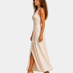 Beige midi dress with cross neckline, ruched bodice and draped side slit
