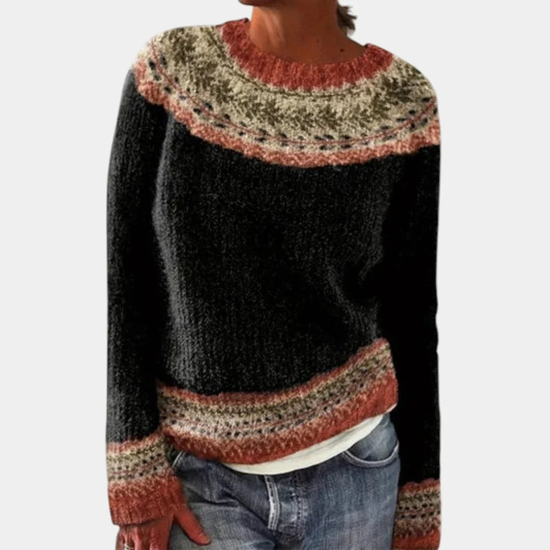 Black knit sweater with speckled yoke and rust stripe bands, crew neck, long sleeves