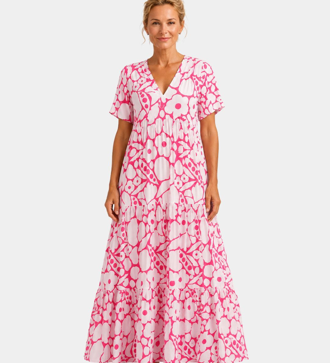 Pink floral maxi dress with V-neck, short sleeves, and tiered skirt