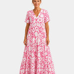 Pink floral maxi dress with V-neck, short sleeves, and tiered skirt