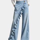 Light blue ruffle-front wide-leg denim pants with scalloped ruffle detail