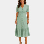 Lightweight shirt dress in light green, short sleeves, button front, tiered skirt hem.