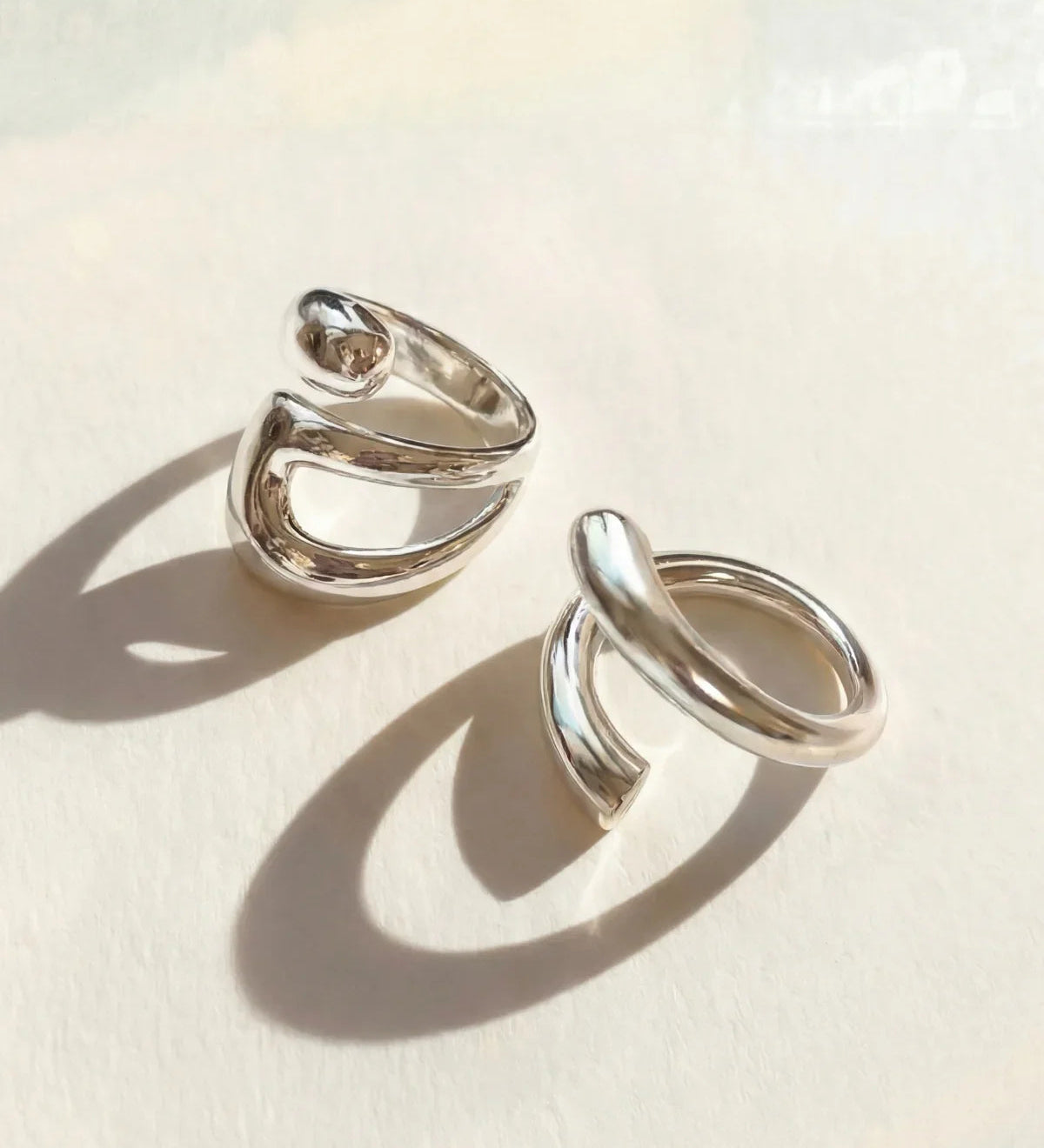Silver ring set with two stacked open oval bands, adjustable fit