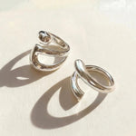 Silver ring set with two stacked open oval bands, adjustable fit