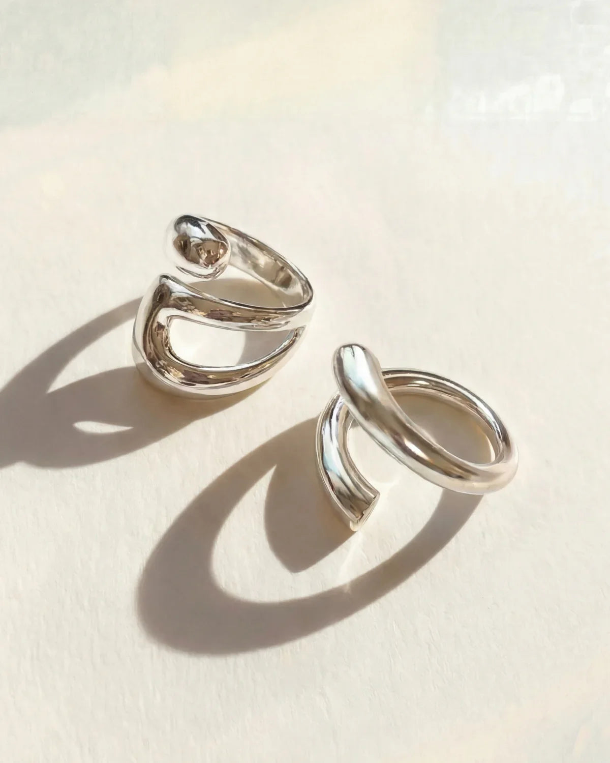 Silver ring set with two stacked open oval bands, adjustable fit