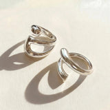 Silver ring set with two stacked open oval bands, adjustable fit