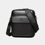 Black leather shoulder bag with front flap and patterned strap detail
