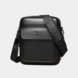 Black leather shoulder bag with front flap and patterned strap detail