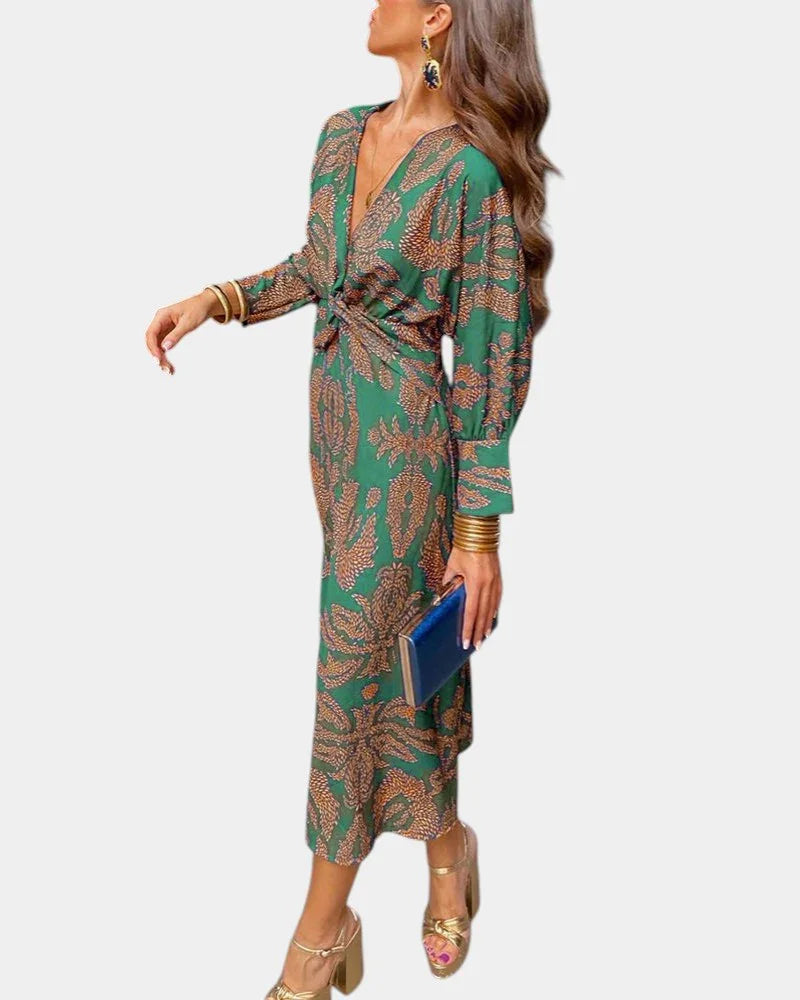 Green long-sleeve V-neck midi dress with draped tie waist and ornate print