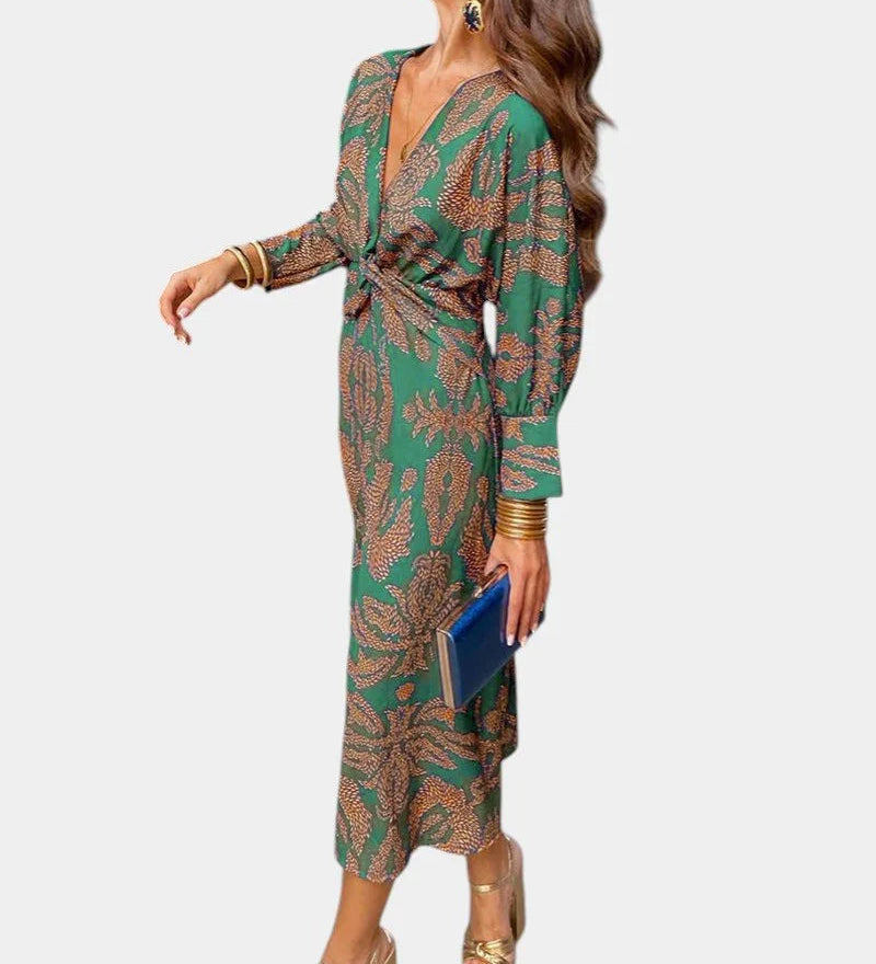 Green long-sleeve V-neck midi dress with draped tie waist and ornate print