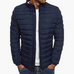 Navy blue puffer down jacket with full zip front and stand collar.