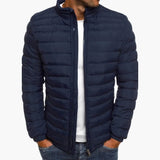 Navy blue puffer down jacket with full zip front and stand collar.