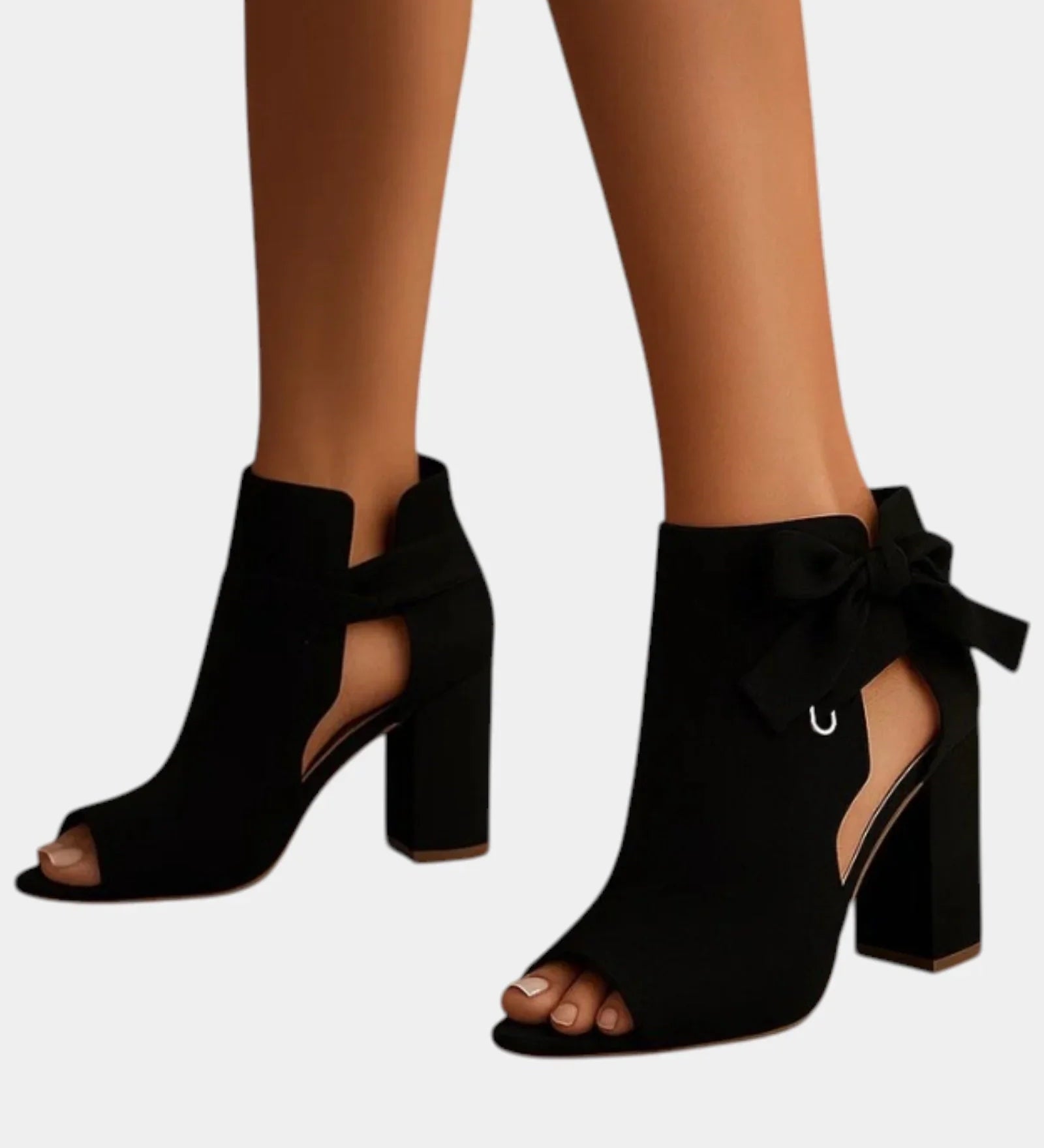 Black heeled sandals with peep toe, ankle bow, and block heel