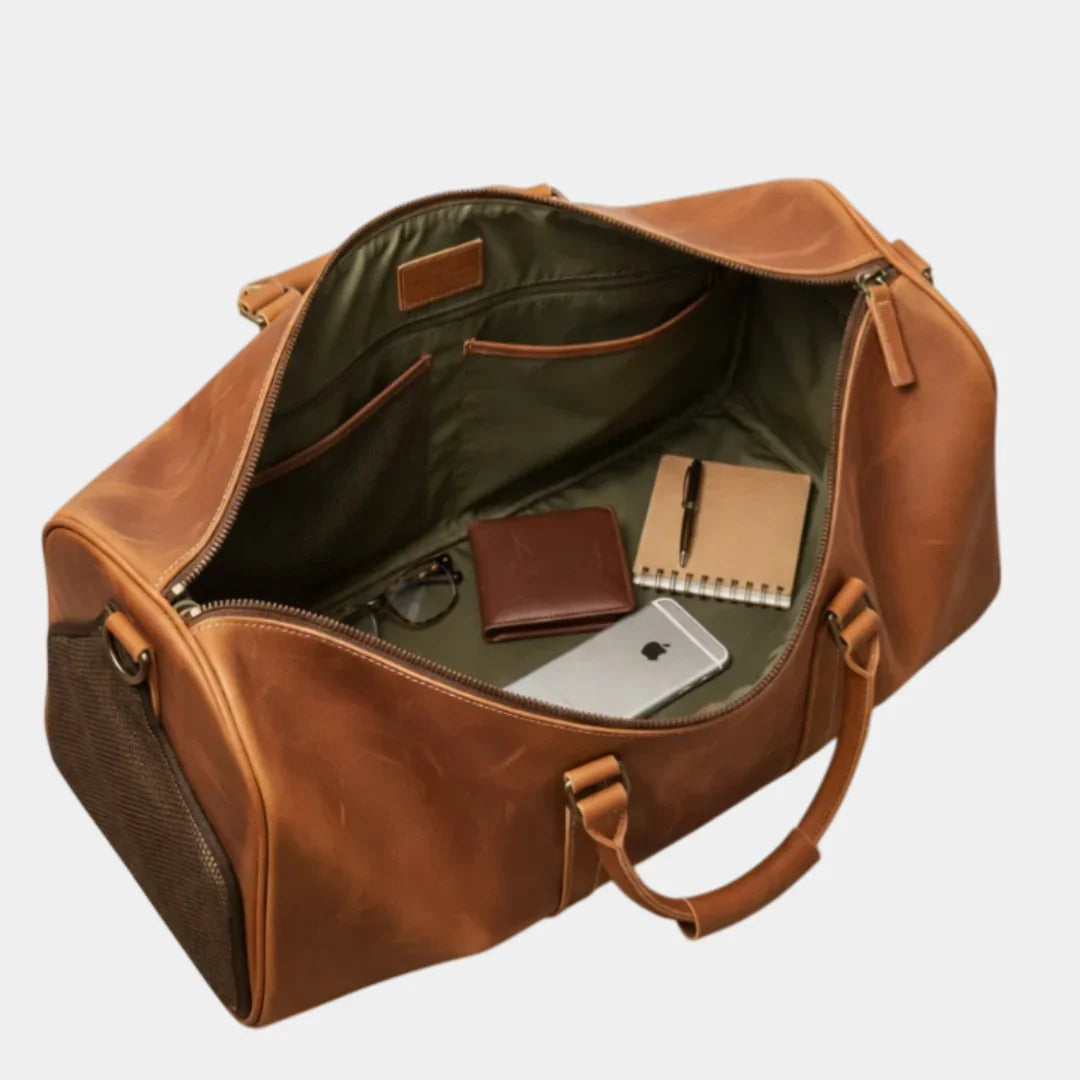 Caramel leather travel bag open top with green lining, inner pockets, and tabs