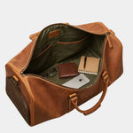 Caramel leather travel bag open top with green lining, inner pockets, and tabs