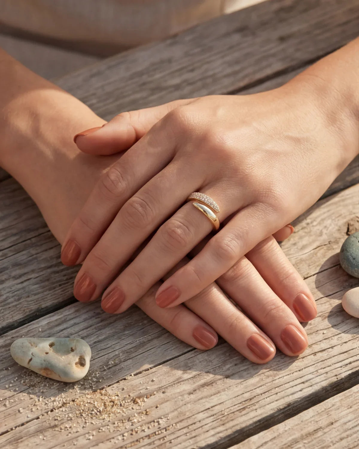Gold adjustable ring with pavé detail on a woman's finger
