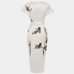 White wrap dress back view, short sleeves, floral print, belted waist, midi length