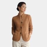 Brown knit cardigan with button front, stand collar, and two patch pockets