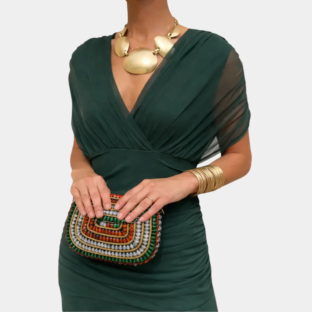 Long dark green dress with draped V-neck, gathered waist, short sheer sleeves