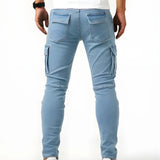 Light blue elastic cargo jeans with back pocket flaps and tapered fit