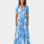 Sky blue floral long dress with V-neck, short puff sleeves, tiered maxi skirt