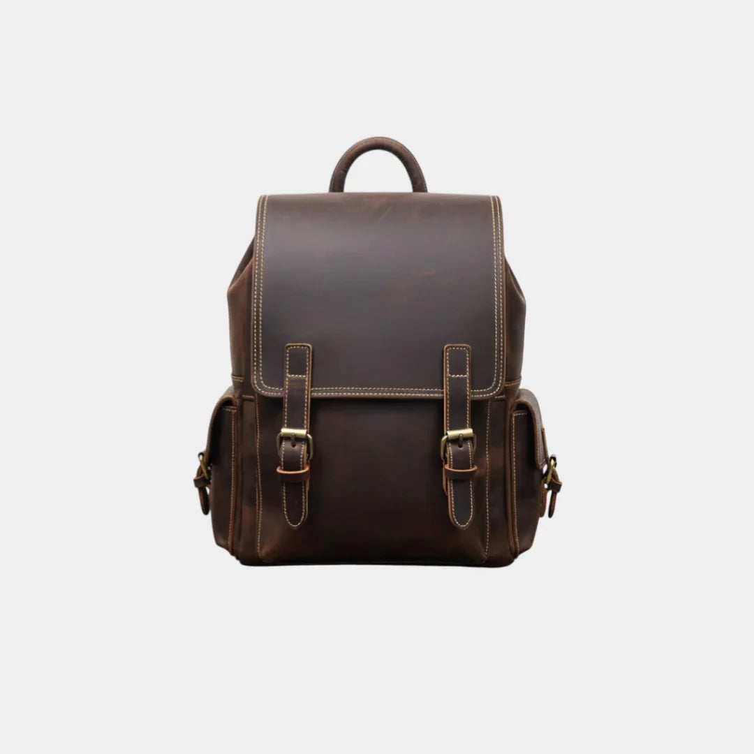 Dark brown leather backpack with front flap and two buckle straps