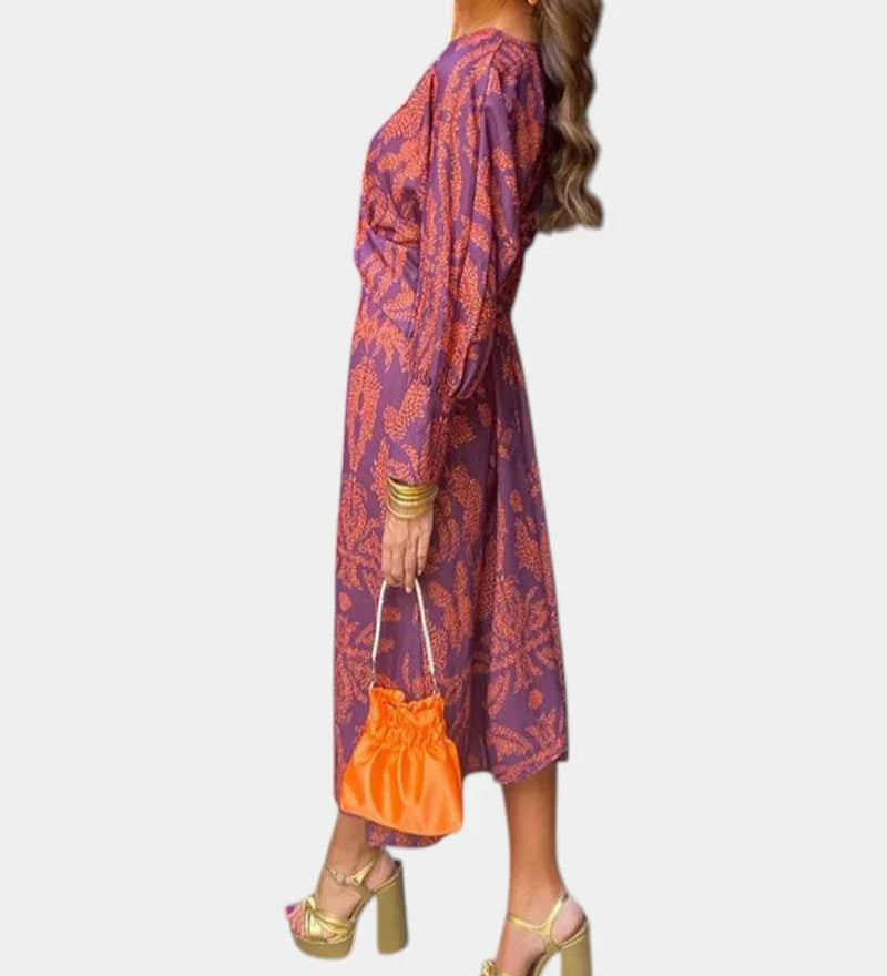 Purple long-sleeve V-neck midi dress with draped tie waist and ornate print