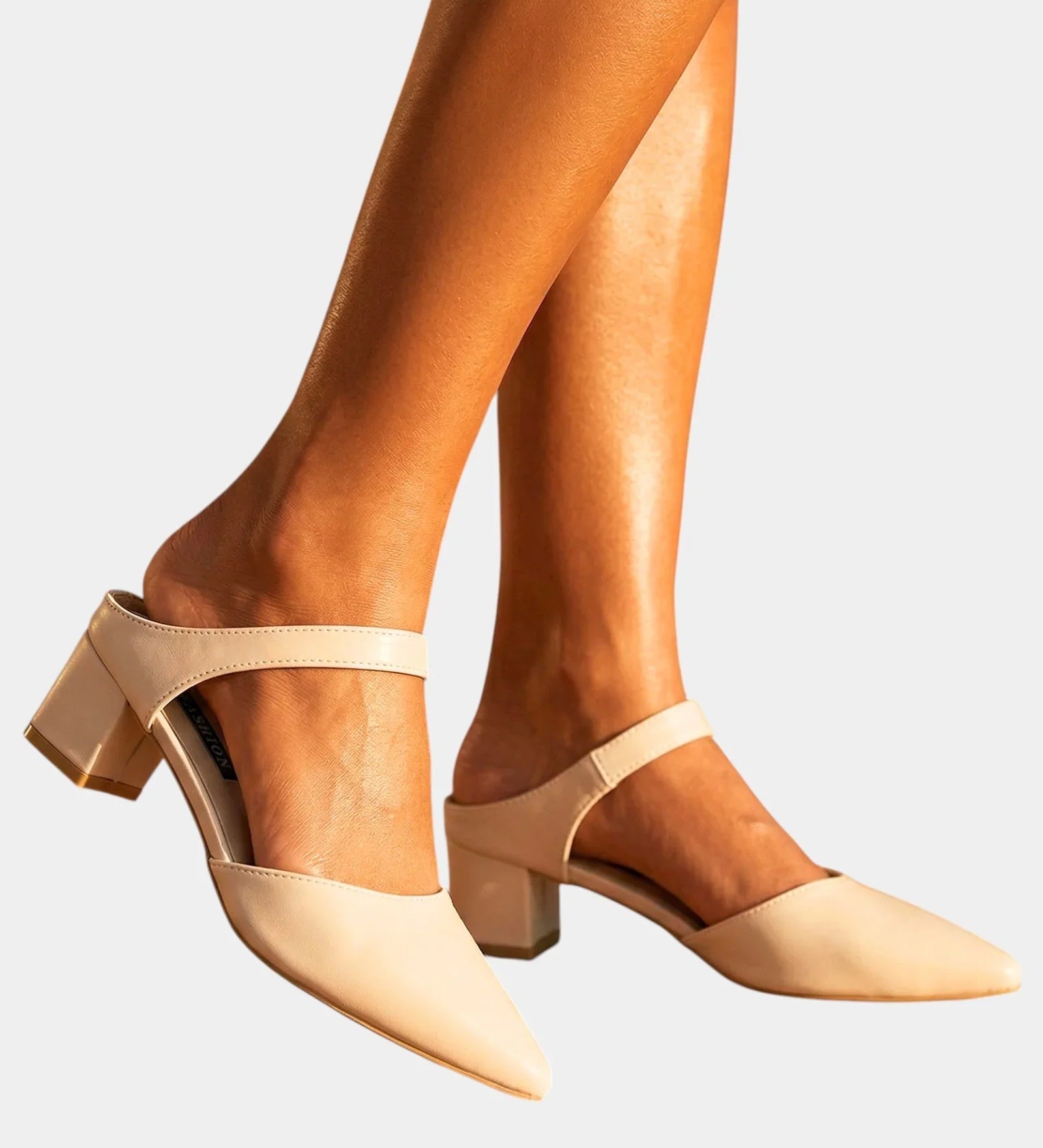 Light beige back-strap heels with pointed toe and mid-height block heel
