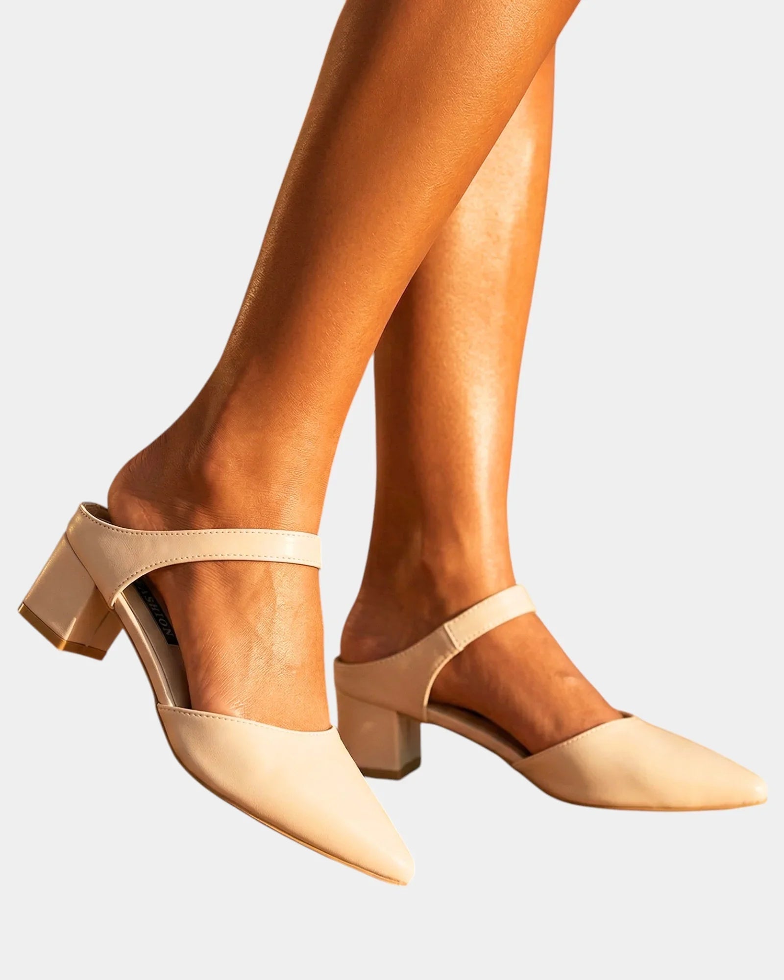 Light beige back-strap heels with pointed toe and mid-height block heel