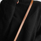 Black turtleneck sweater with ribbed collar and long sleeves