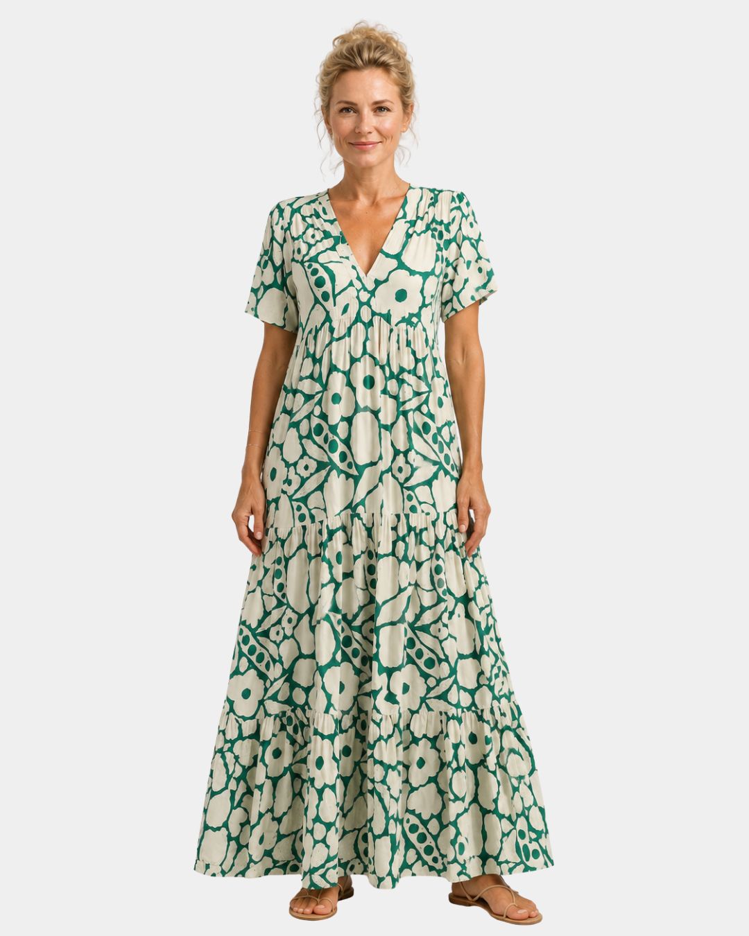 Green floral maxi dress with V-neck, short sleeves, and tiered skirt