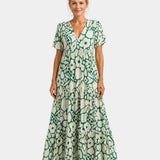 Green floral maxi dress with V-neck, short sleeves, and tiered skirt