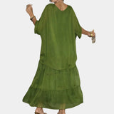 Green tiered maxi dress with flowy silhouette and layered ruffle hem