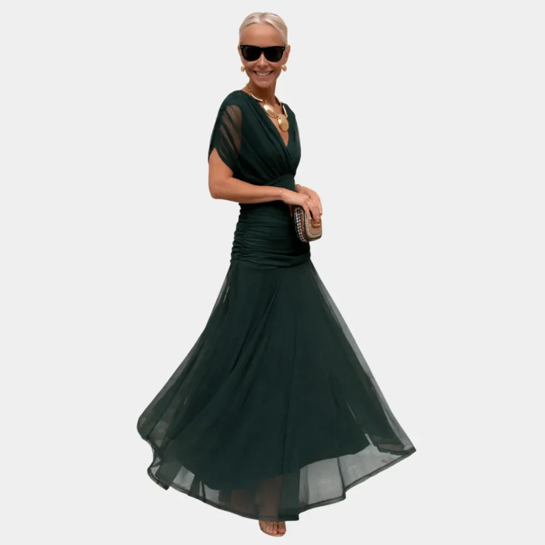 Long dark green dress with V-neck and flared tulle skirt, short sleeves