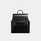 Black leather backpack with top flap, arched handle, and front zip pockets