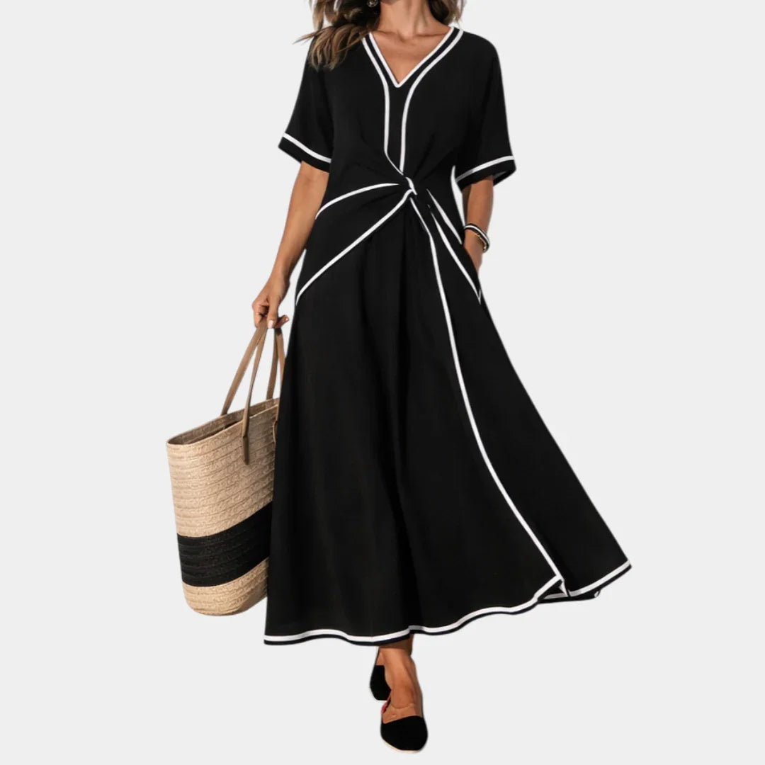 Black V-neck spring dress with short sleeves, waist knot, and A-line midi skirt