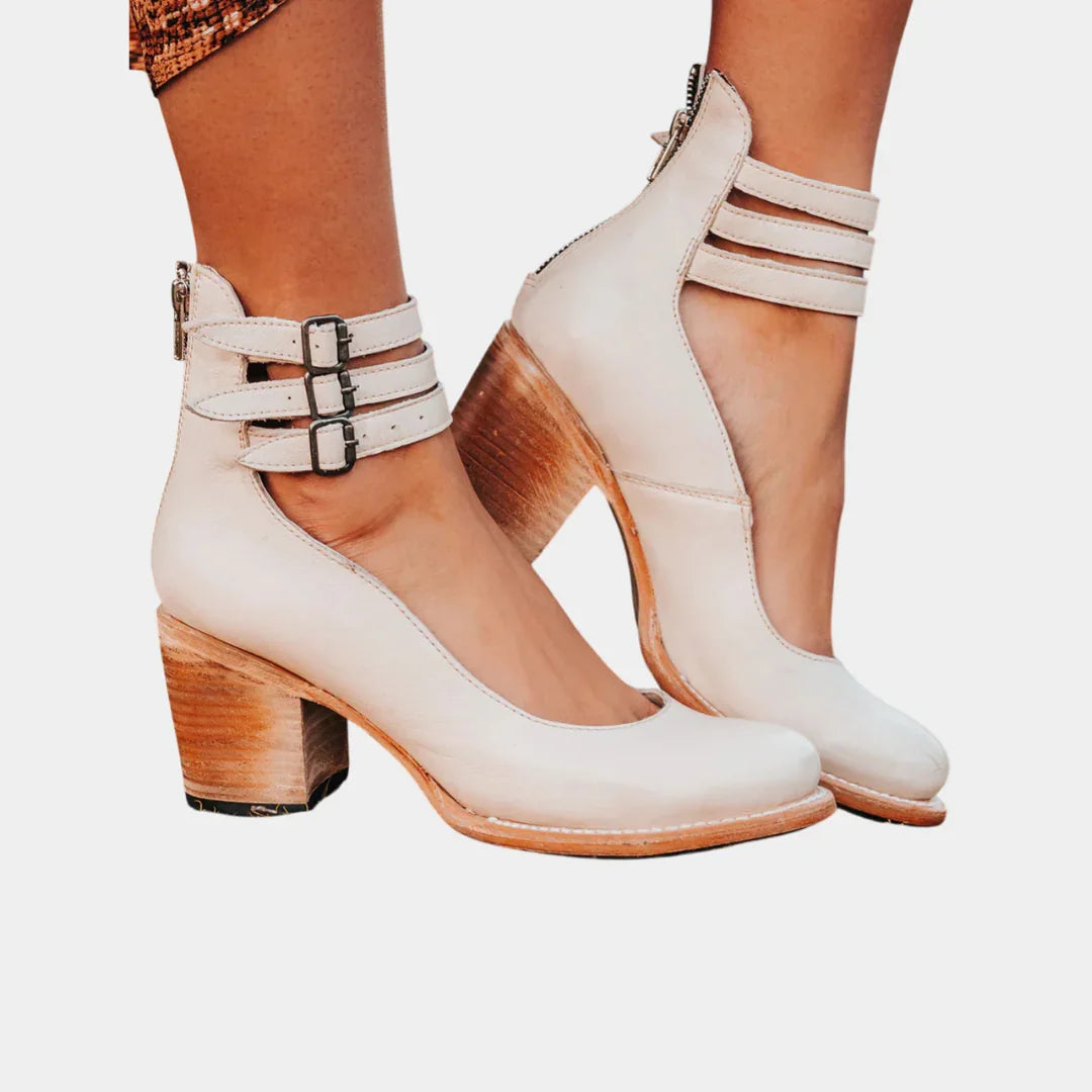 White ankle-strap block heel shoes with two straps and buckle, pointed toe