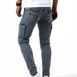 Dark gray elastic cargo jeans with back pocket flaps and side utility pockets