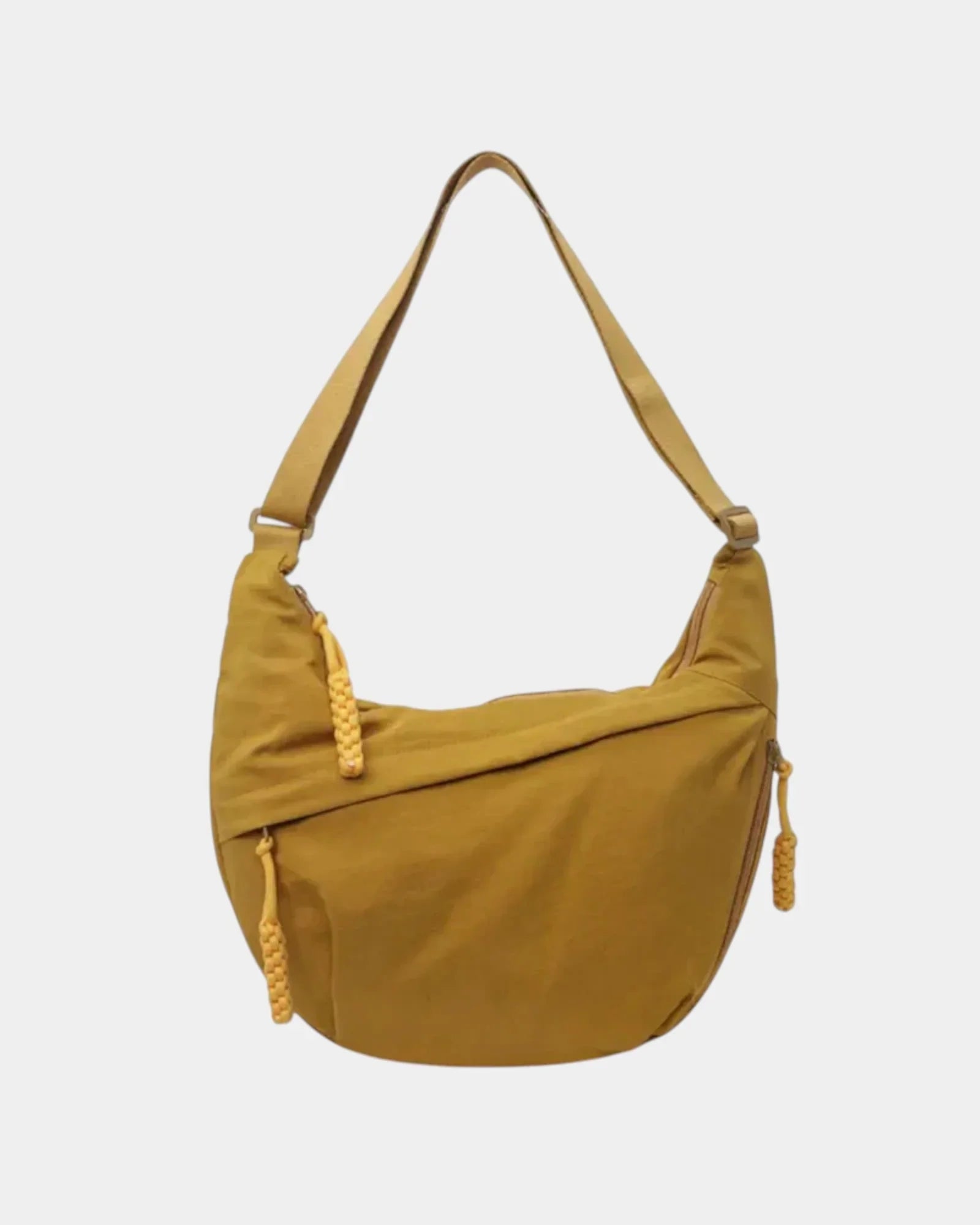 Yellow anti-theft crossbody bag with curved hobo shape, adjustable strap, and zipper detail.
